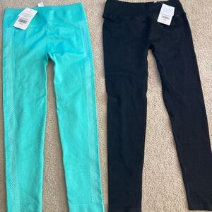 NWT - 2 pairs size large Fabletics High Waisted seamless leggings.